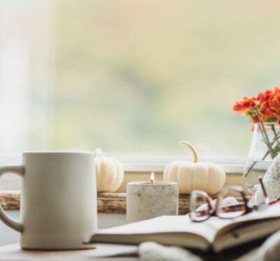 Cozy room with a coffee mug and candles