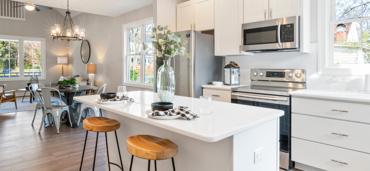 Kitchen with white cabinets and an white kitchen island.