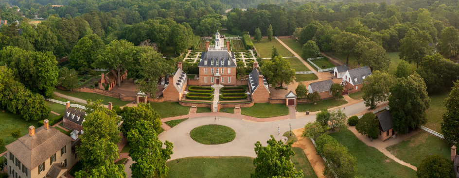 An aerial view of the Governor's Palace in Colonial Williamsburg with formal gardens.